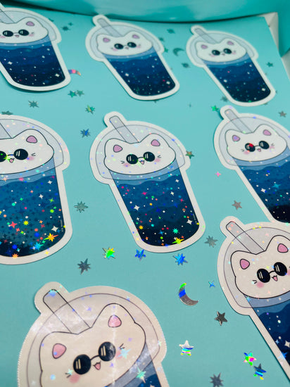 multiple cat boba gleaming holographic stickers aligned in a pattern