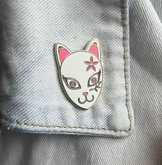 white kitsune fox mask with pink flower and vine designs